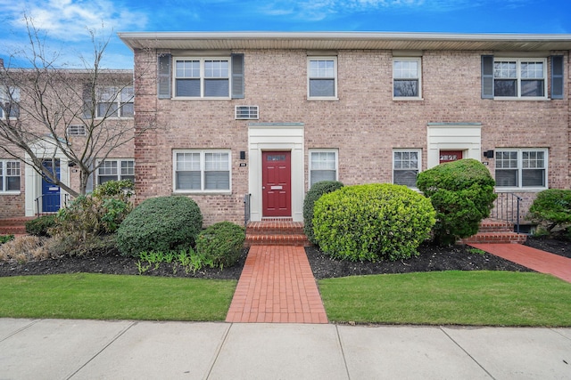 townhome / multi-family property featuring brick siding