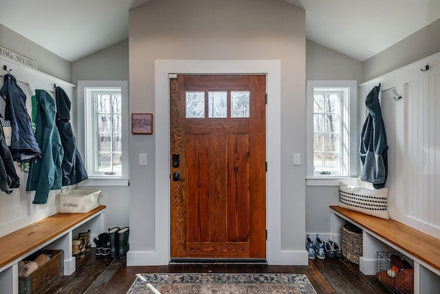 mudroom with vaulted ceiling, wood finished floors, plenty of natural light, and baseboards