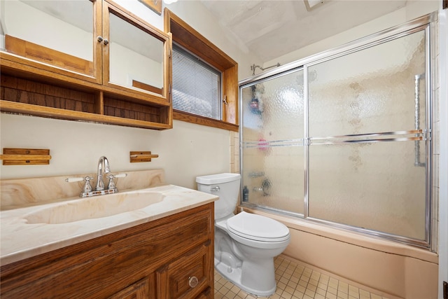 bathroom with vanity, toilet, tile patterned flooring, and shower / bath combination with glass door