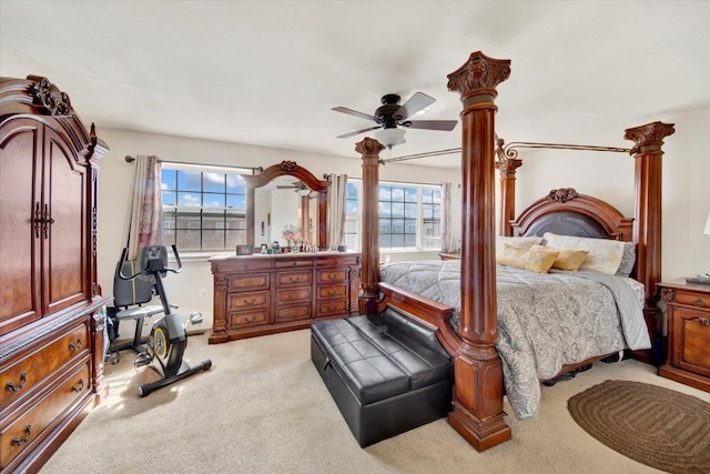 bedroom featuring a ceiling fan and light colored carpet