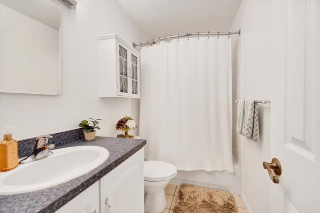 full bathroom with vanity, toilet, tile patterned flooring, and shower / bath combo with shower curtain