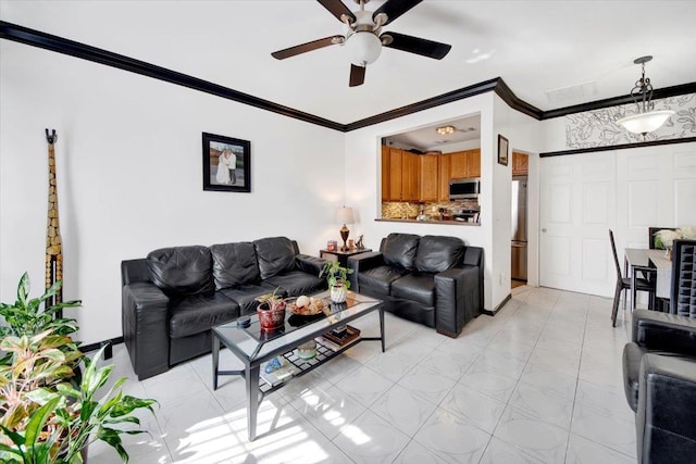 living room with a ceiling fan and crown molding