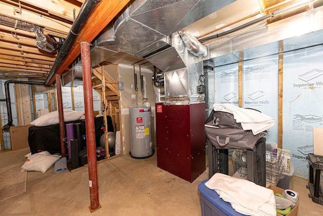 unfinished basement featuring water heater