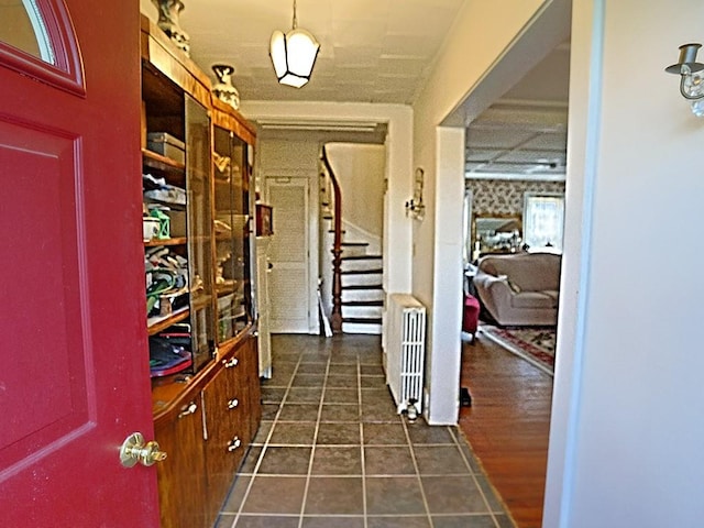 4073 Rte 9w, Saugerties, NY 12477 - hallway featuring radiator heating unit, dark tile patterned floors, and stairs