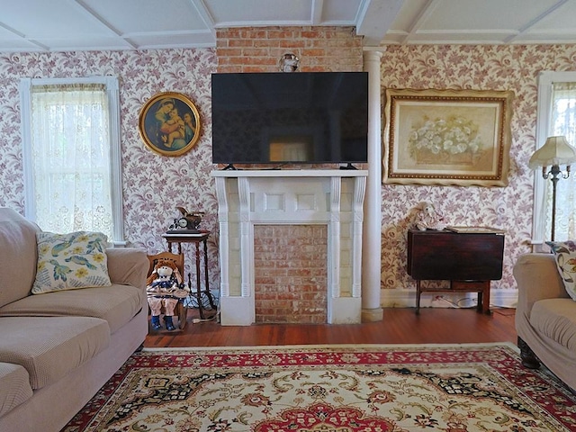 4073 Rte 9w, Saugerties, NY 12477 - living area featuring a fireplace, wood finished floors, ornamental molding, and wallpapered walls
