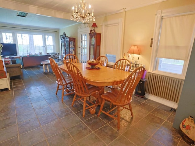 4073 Rte 9w, Saugerties, NY 12477 - dining space featuring radiator heating unit, ornamental molding, and a notable chandelier