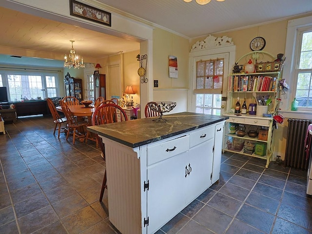 4073 Rte 9w, Saugerties, NY 12477 - kitchen with ornamental molding, an inviting chandelier, a wealth of natural light, and white cabinetry
