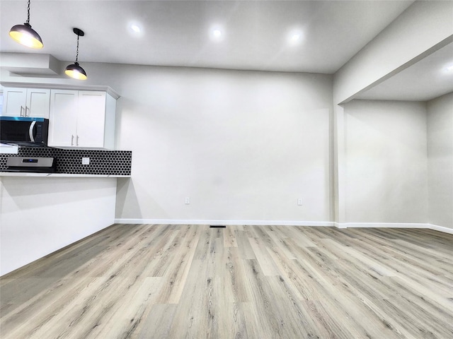 24 Wayne St, Staten Island, NY 10310 - unfurnished dining area with light wood-style flooring, baseboards, and recessed lighting