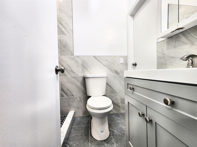 24 Wayne St, Staten Island, NY 10310 - bathroom featuring toilet, vanity, and tile walls