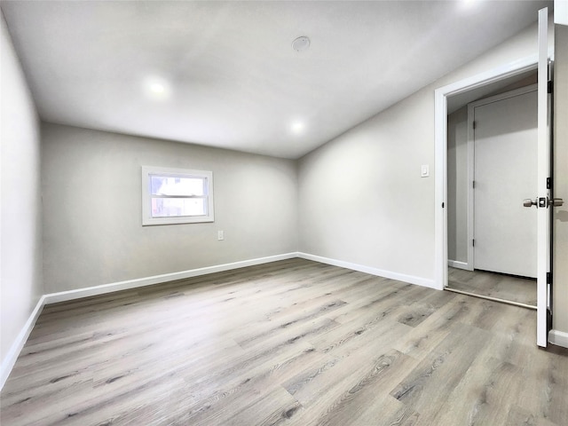 24 Wayne St, Staten Island, NY 10310 - below grade area with baseboards, wood finished floors, and recessed lighting