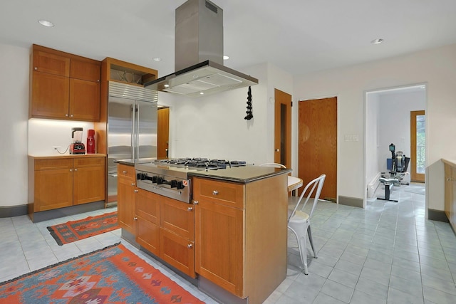 kitchen with light tile patterned floors, stainless steel appliances, recessed lighting, and island exhaust hood