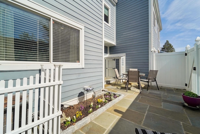 view of patio / terrace featuring fence and outdoor dining area