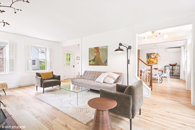893 Laroe Rd, Monroe, NY 10950 - living area featuring a wall mounted AC and light wood finished floors