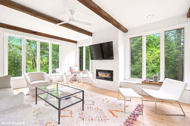 893 Laroe Rd, Monroe, NY 10950 - living room with plenty of natural light, wood finished floors, a large fireplace, and beam ceiling