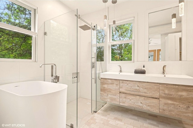 893 Laroe Rd, Monroe, NY 10950 - full bathroom featuring tile walls, a shower stall, plenty of natural light, and a freestanding bath