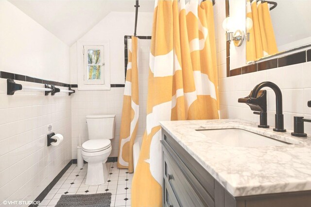 893 Laroe Rd, Monroe, NY 10950 - bathroom with tile walls, toilet, vanity, vaulted ceiling, and a shower with curtain