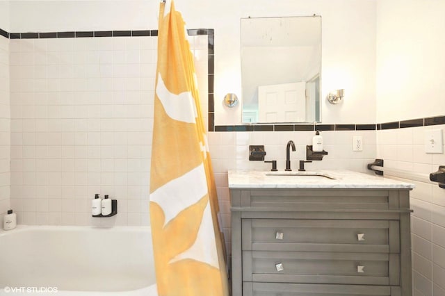 893 Laroe Rd, Monroe, NY 10950 - bathroom featuring tile walls, vanity, and shower / bathtub combination with curtain