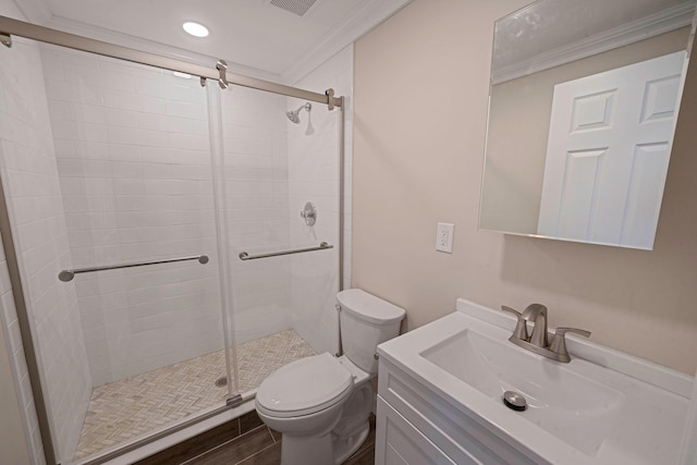 bathroom featuring a stall shower, toilet, recessed lighting, vanity, and ornamental molding