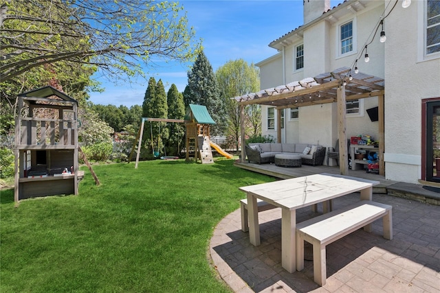 view of yard with a playground, a pergola, an outdoor living space, and a patio area