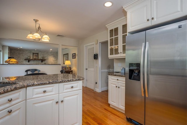 26 Strathmore Dr, New City, NY 10956 - kitchen with white cabinets, stainless steel fridge, glass insert cabinets, and light wood finished floors