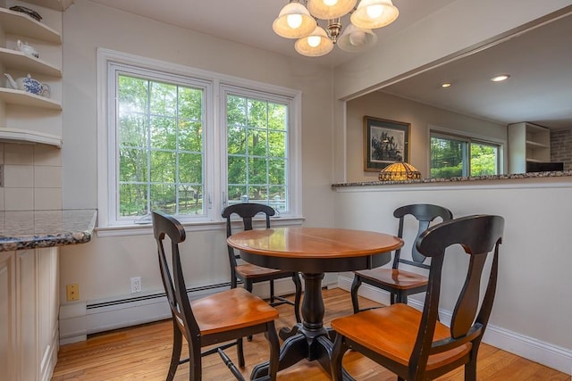 26 Strathmore Dr, New City, NY 10956 - dining room with light wood-style floors, baseboards, and a notable chandelier