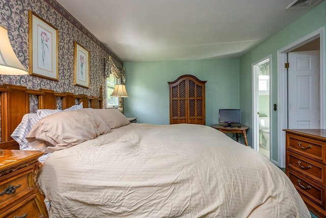 26 Strathmore Dr, New City, NY 10956 - bedroom featuring multiple windows, wallpapered walls, connected bathroom, and visible vents