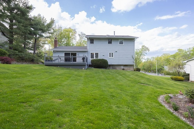 26 Strathmore Dr, New City, NY 10956 - rear view of property featuring a wooden deck, a chimney, and a yard