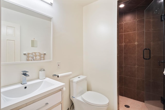 full bathroom with a stall shower, vanity, and toilet
