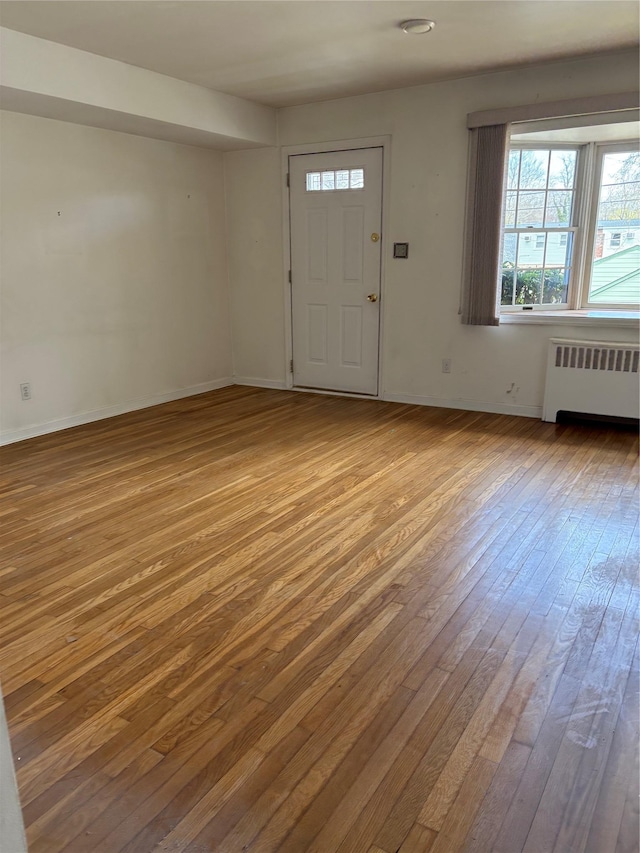 8 Dee Pl, Huntington Station, NY 11746 - foyer featuring hardwood / wood-style flooring, radiator, and baseboards