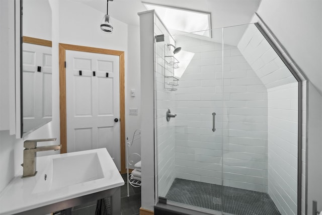 full bathroom with a stall shower and a sink