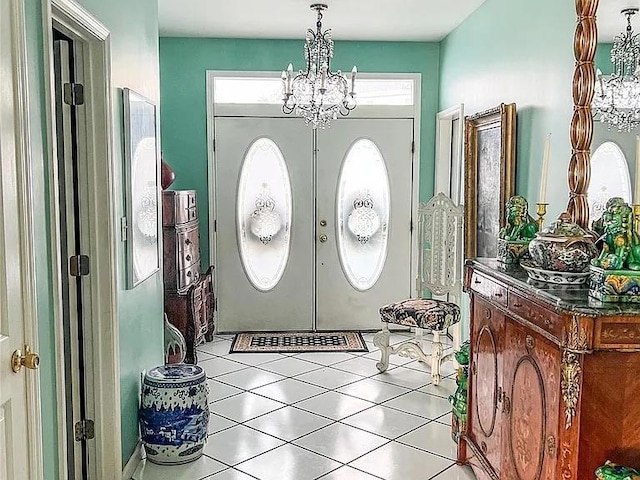 282 Tamerisk Ln, New Windsor, NY 12553 - entryway with french doors, a chandelier, and tile patterned floors