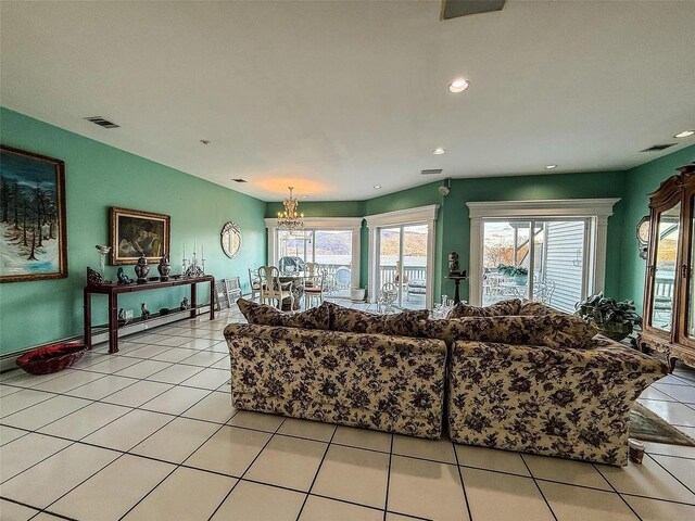 282 Tamerisk Ln, New Windsor, NY 12553 - living room featuring a chandelier, plenty of natural light, light tile patterned flooring, and recessed lighting