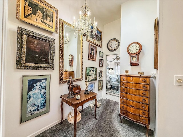 282 Tamerisk Ln, New Windsor, NY 12553 - hallway with baseboards and a chandelier