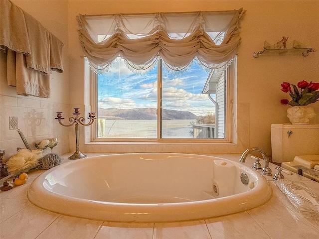 282 Tamerisk Ln, New Windsor, NY 12553 - bathroom with a tub with jets and tile patterned flooring