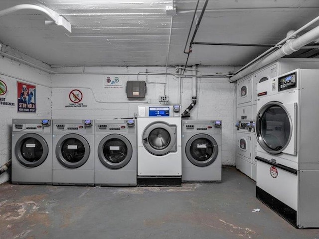 community laundry room featuring washing machine and dryer