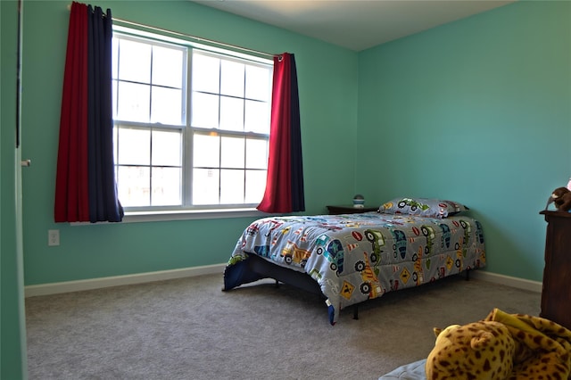 carpeted bedroom with baseboards