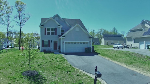 traditional-style home featuring driveway and a front yard