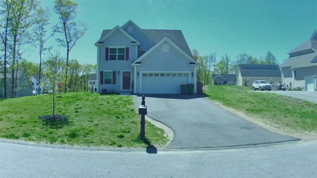 view of front facade with driveway and a front lawn