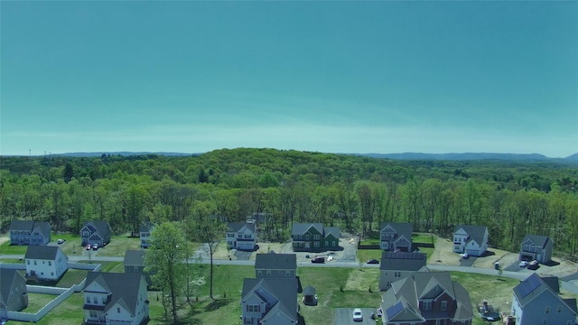 birds eye view of property with a residential view and a view of trees
