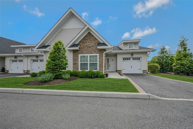 2300 Fox Hill Dr Unit 1101, Baiting Hollow, NY 11933 - view of front of house with driveway, stone siding, and a front lawn
