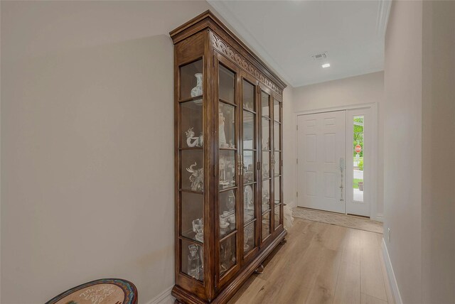 2300 Fox Hill Dr Unit 1101, Baiting Hollow, NY 11933 - foyer entrance with baseboards and light wood-style floors