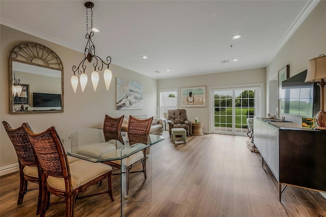 2300 Fox Hill Dr Unit 1101, Baiting Hollow, NY 11933 - dining space with ornamental molding, wood finished floors, and baseboards