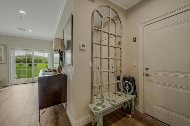 2300 Fox Hill Dr Unit 1101, Baiting Hollow, NY 11933 - doorway to outside with ornamental molding, wood finished floors, and baseboards