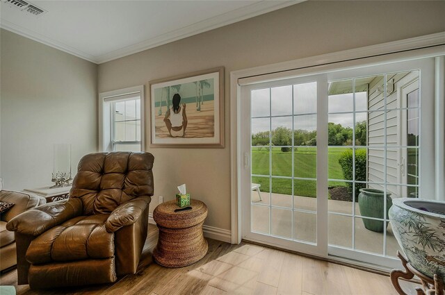 2300 Fox Hill Dr Unit 1101, Baiting Hollow, NY 11933 - living area with crown molding, baseboards, and light wood finished floors