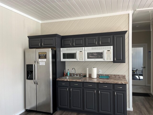 2300 Fox Hill Dr Unit 1101, Baiting Hollow, NY 11933 - kitchen with stainless steel fridge with ice dispenser, a sink, ornamental molding, wood walls, and dark wood-style flooring