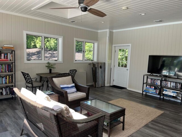 2300 Fox Hill Dr Unit 1101, Baiting Hollow, NY 11933 - living area with dark wood-type flooring, ceiling fan, baseboards, and wood walls