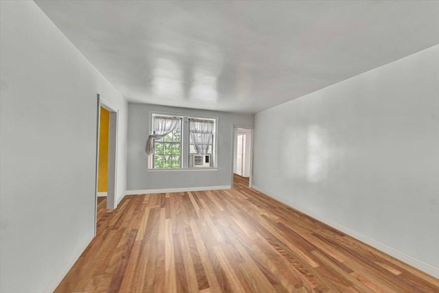100 Parkway Rd Unit 4C, Bronxville, NY 10708 - empty room with wood finished floors and cooling unit