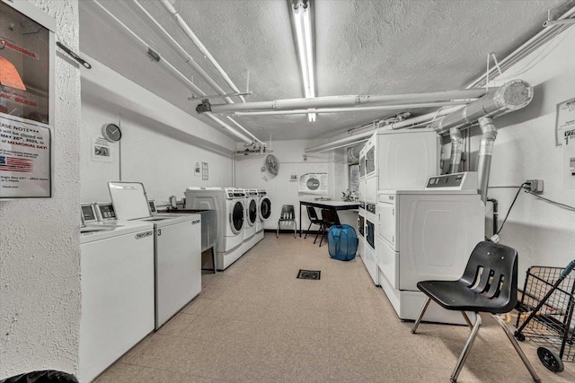100 Parkway Rd Unit 4C, Bronxville, NY 10708 - community laundry with independent washer and dryer, light flooring, estacked washer and dryer, and a textured ceiling