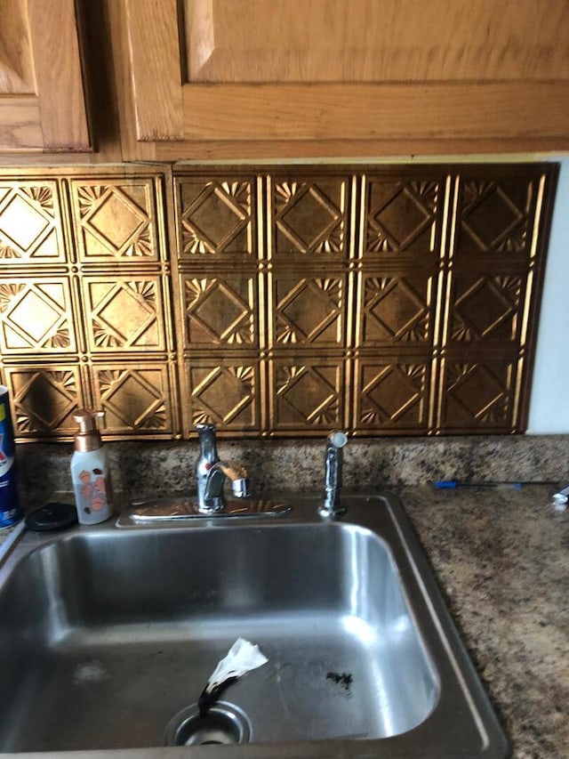 interior details with a sink and tasteful backsplash