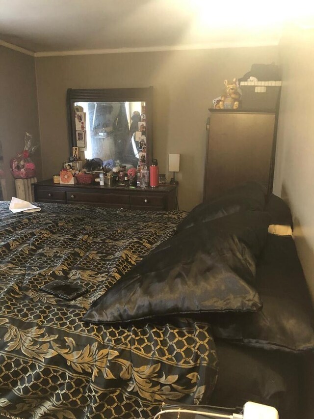 bedroom featuring crown molding